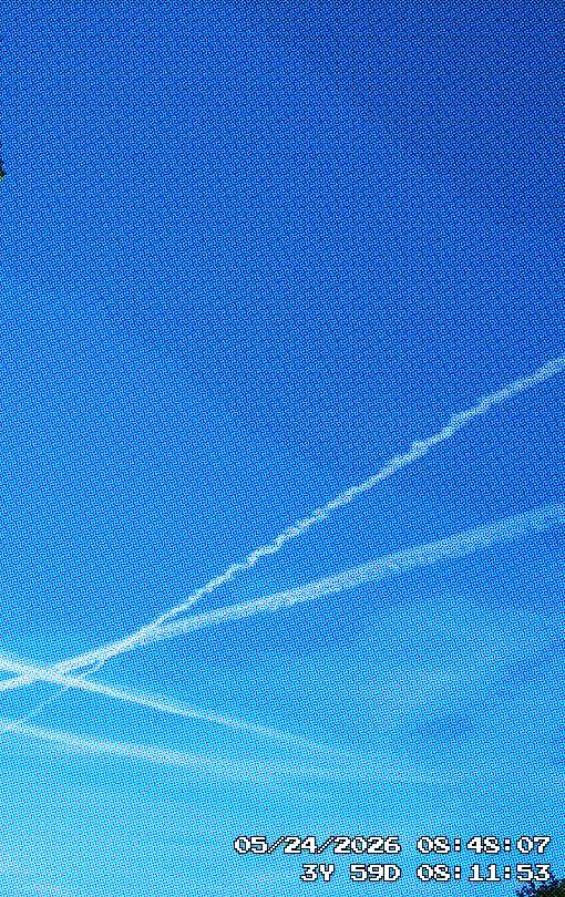 Aeroplane trails crossing in the sky